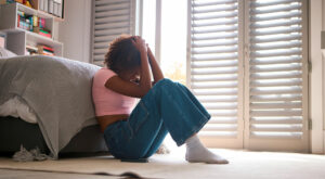 teenage girl sad in room