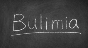 Bulimia word written on chalkboard