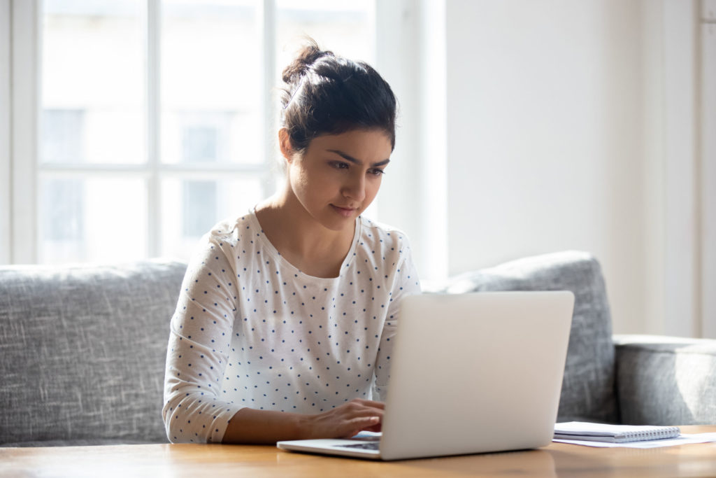 Woman looking up website